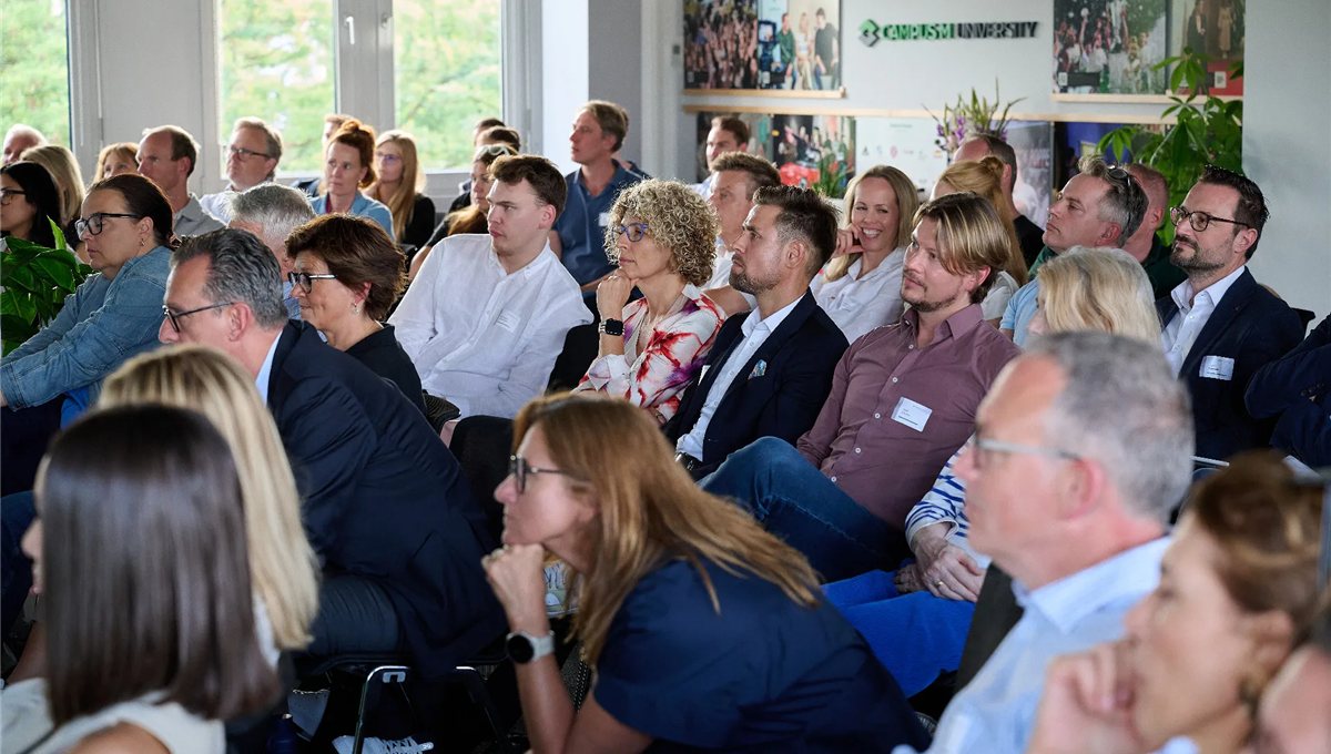 A seated audience listening to a session at a leadership conference.
